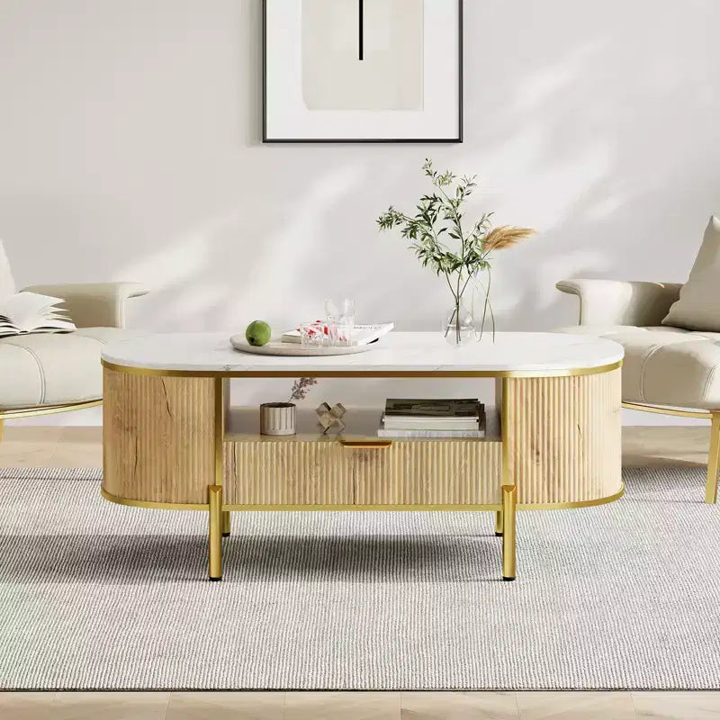 Table basse ovale cannelée bleu / chêne avec plateau effet marbre, cadre doré et tiroir