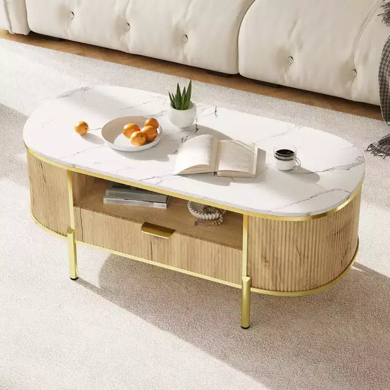 Table basse ovale cannelée bleu / chêne avec plateau effet marbre, cadre doré et tiroir