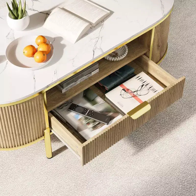 Table basse ovale cannelée bleu / chêne avec plateau effet marbre, cadre doré et tiroir
