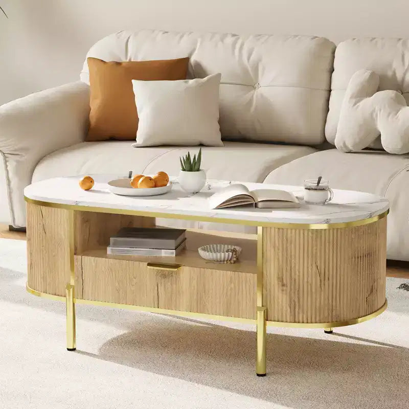 Table basse ovale cannelée bleu / chêne avec plateau effet marbre, cadre doré et tiroir